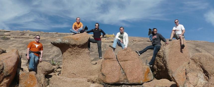 Class on a field trip posing on rocks